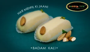 Two almond sweets on a green background.