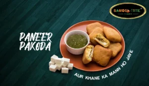 Paneer pakoda with green chutney and cubes.