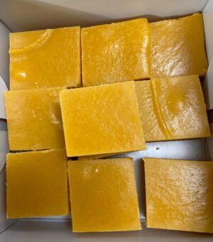 Nine square pieces of yellow cake dessert.