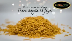 Pile of crispy bhujia with text overlay.
