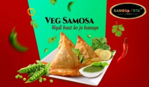 Veg samosa with green chutney and vegetables.