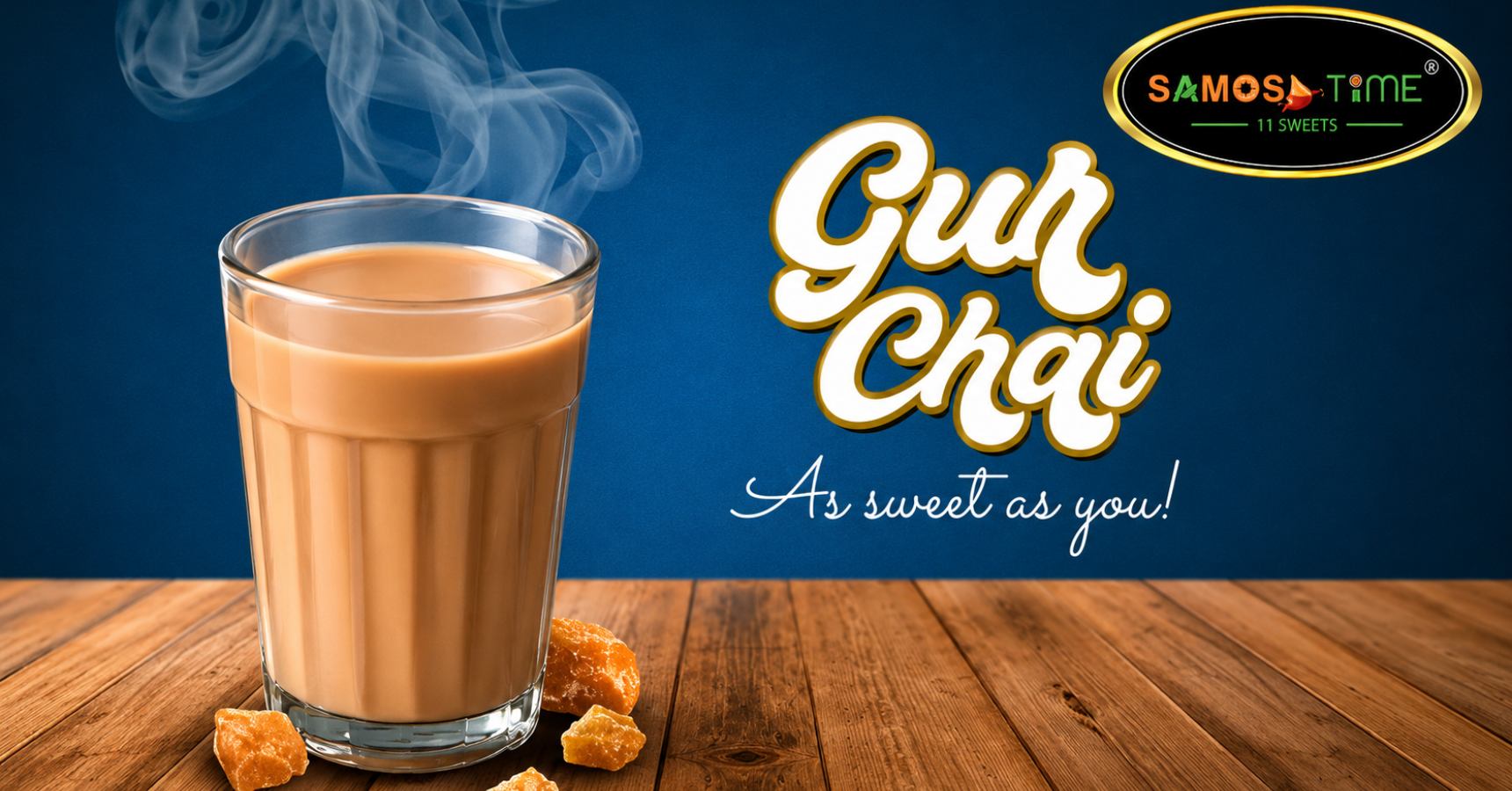 Glass of steaming chai with jaggery pieces.